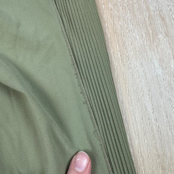 Athleta Salutation Stash Pocket II Laser Cut 7/8 Tight Olive Green Leggings XS - Picture 15 of 16